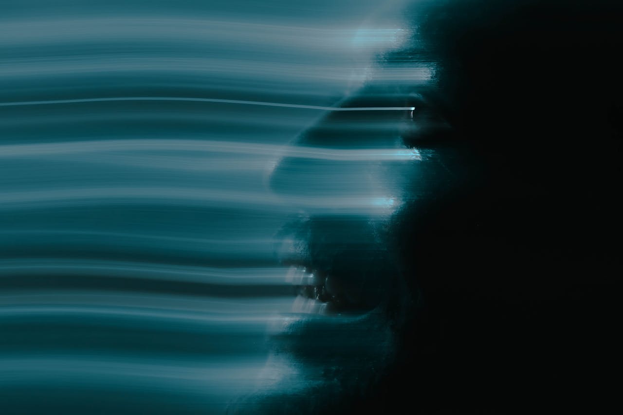 our-story Artistic abstract portrait of a man's face using motion blur for a spooky and creative effect.